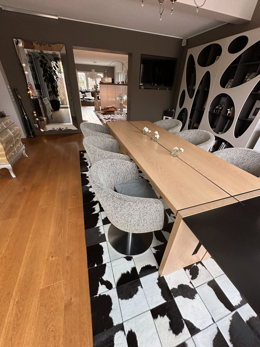 Custom Black & White Cowhide Patchwork Rug in Dining Room, Wide View