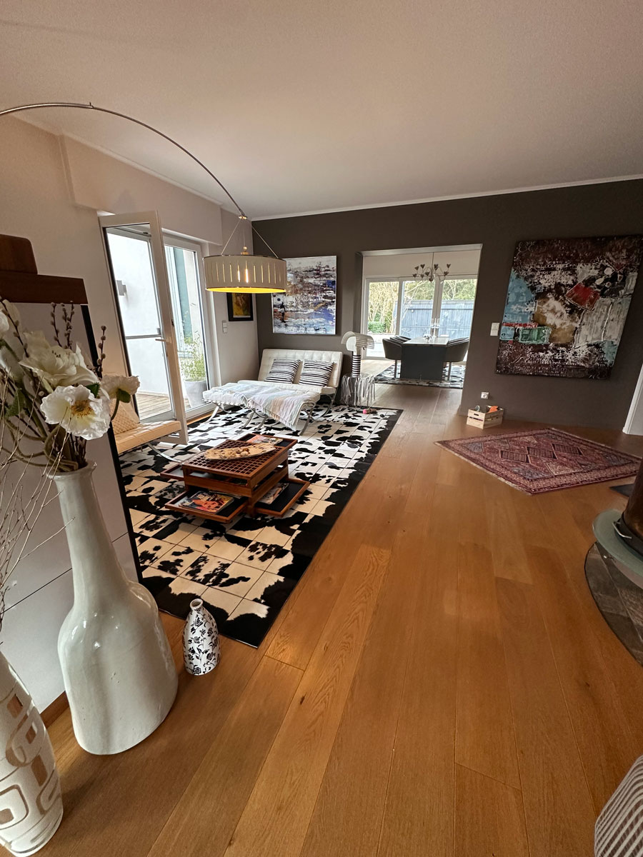 Custom Black & White Cowhide Patchwork Rug in Dining Room, Wide View